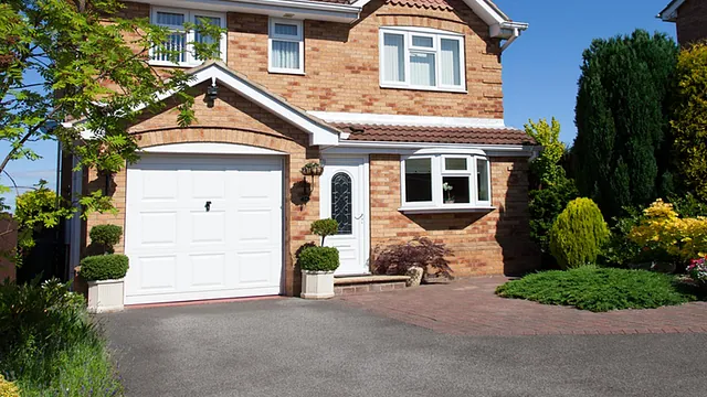A home with a new tarmac driveway